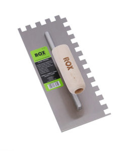 Image-of-a-12mm-square-notched-high-carbon-steel-contractor-tiling-trowel-with-a-wooden-handle-labeled-as-a-ROX-brand-tool-designed-for-spreading-adhesive-during-tile-installation.