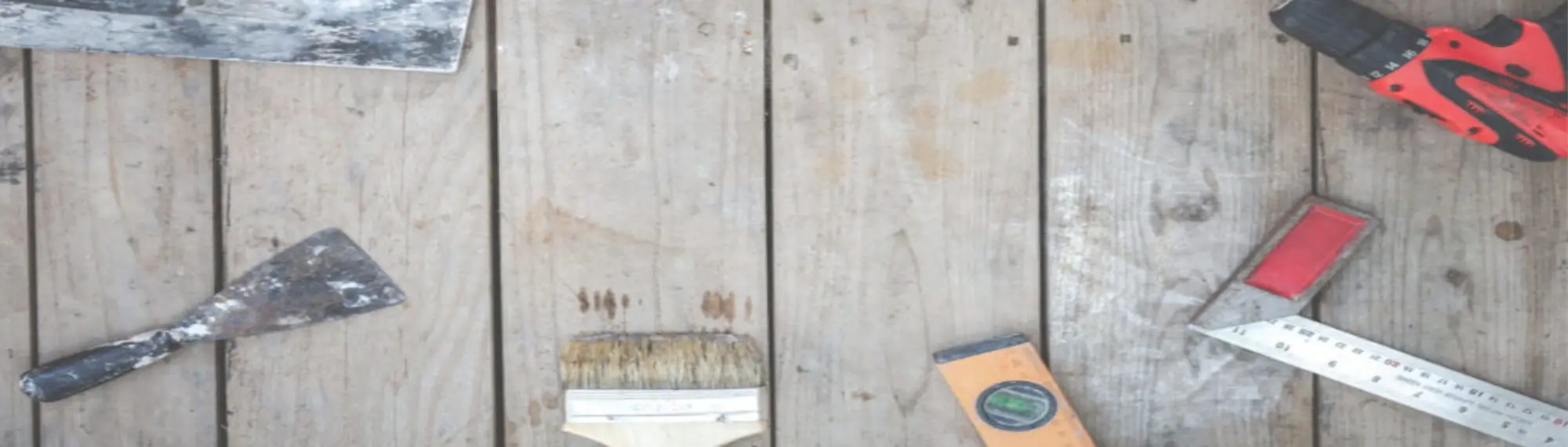 A gauging trowel among other various construction tools